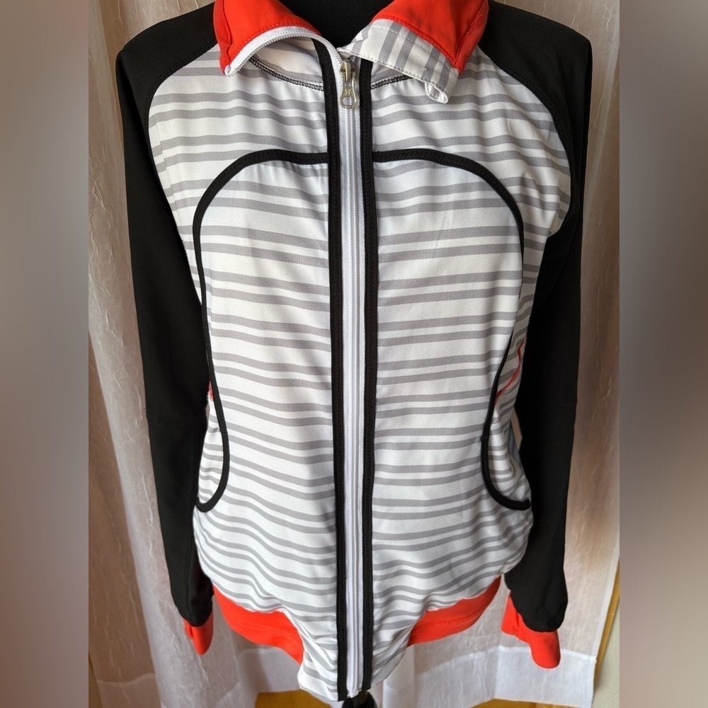 Lululemon Run: Track Attack jacket in Twin Stripe Black, and Love Red